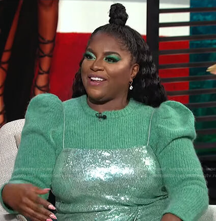 Ester Dean's green puff sleeve sweater and sequin dress on E! News Daily Pop