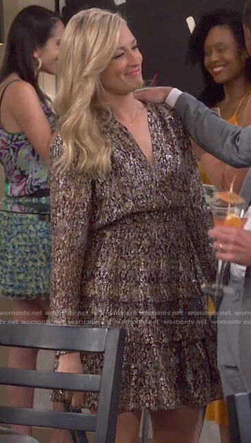 Gemma's metallic long sleeved dress on The Neighborhood