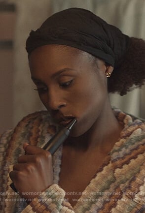 Issa's T logo earrings on Insecure
