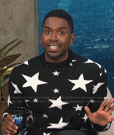 Justin's black star print sweater on E! News Daily Pop
