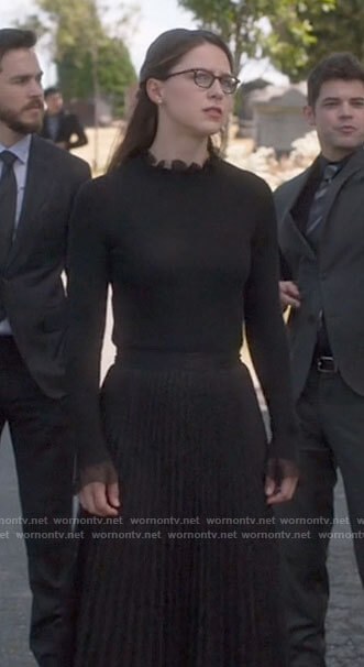 Kara's black ruffle neck sweater on Supergirl