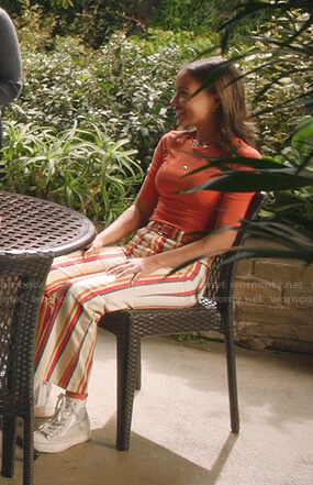 May's orange top and striped flare pants on 9-1-1