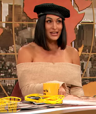 Nikki Bella's beige off shoulder sweater dress on The Drew Barrymore Show