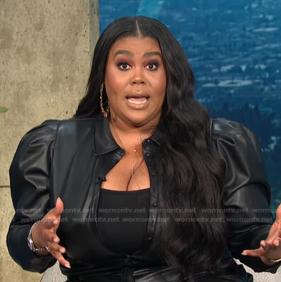 Nina's black puff sleeve blouse and pants on E! News Nightly Pop