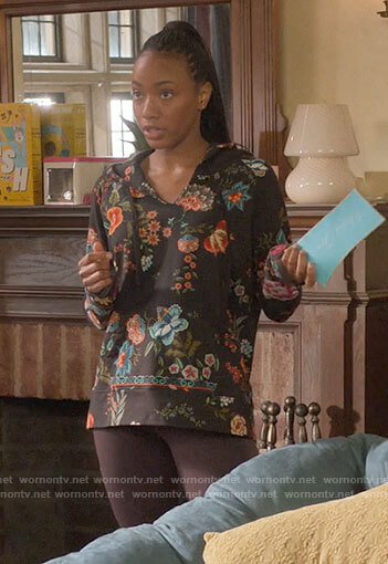 Whitney's black floral hoodie on The Sex Lives of College Girls