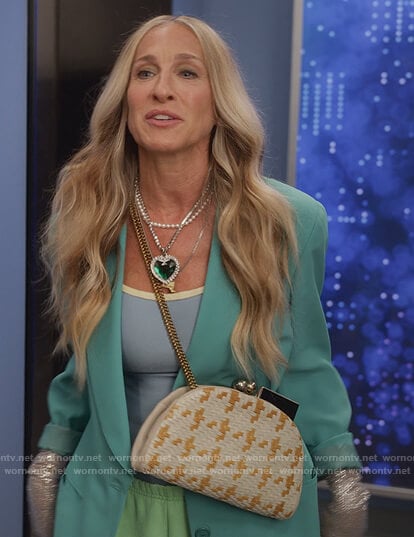 Carrie's neon green joggers and embellished heart necklace on And Just Like That