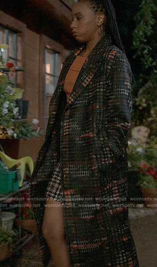 Whitney's long printed coat on The Sex Lives of College Girls