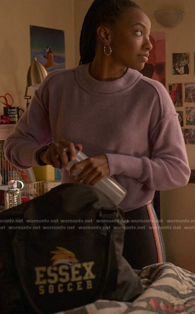 Whitney's purple sweater and rainbow stripe leggings on The Sex Lives of College Girls