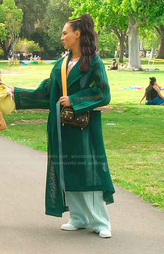 Amanza's green mesh coat and side striped pants on Selling Sunset