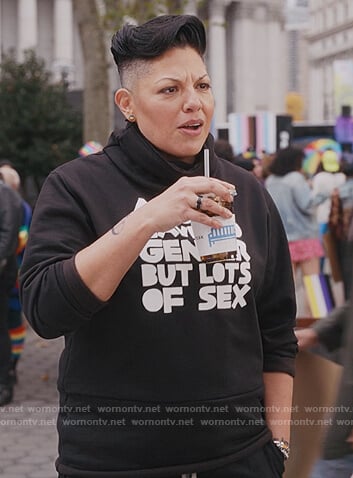 Ches' Angels Have no Gender sweatshirt on And Just Like That
