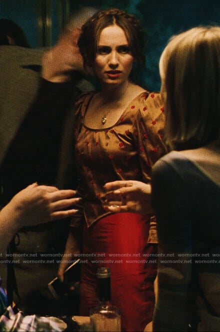 Lexi's bronze flower embroidered top and pink pants on Euphoria