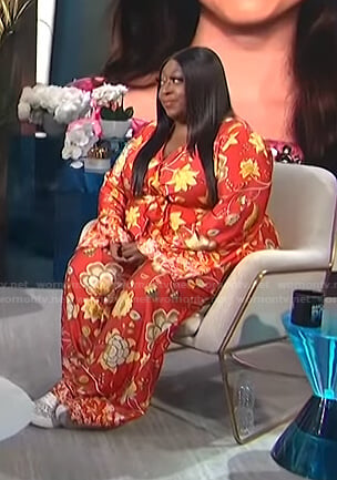 Loni's red floral jumpsuit on E! News Daily Pop