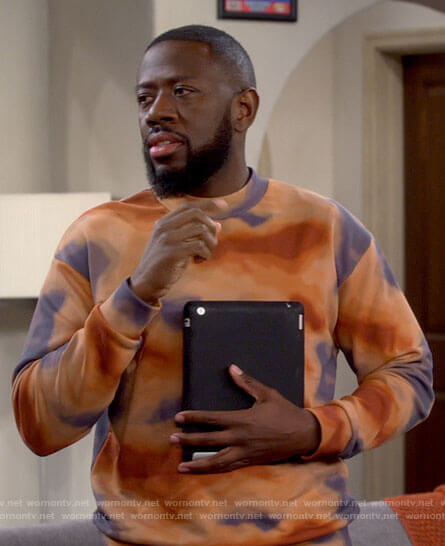 Malcolm's orange tie dye sweater on The Neighborhood