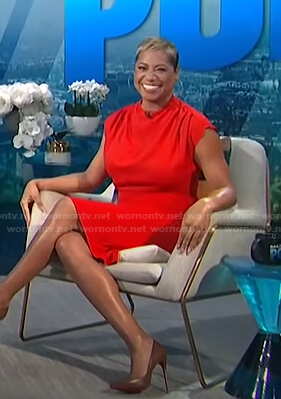 Monique’s red mock neck dress on E! News Daily Pop