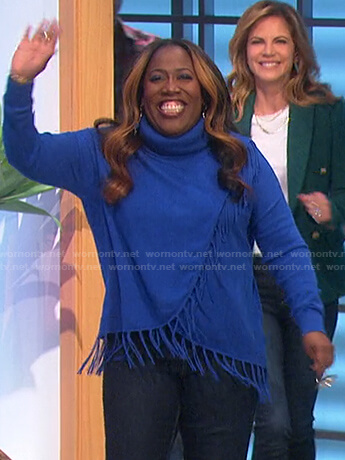 Sheryl’s blue fringe turtleneck sweater on The Talk