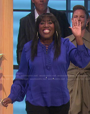 Sheryl's blue ruffled lace-up blouse on The Talk