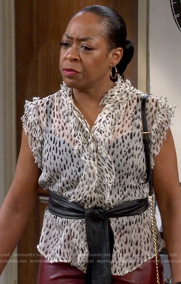 Tina's printed ruffled button down top on The Neighborhood
