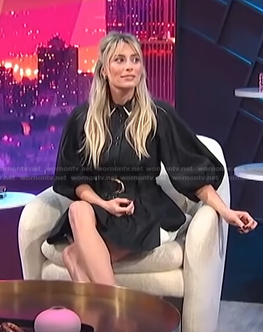 Arielle Vandenberg's black balloon sleeve belted dress on E! News Nightly Pop