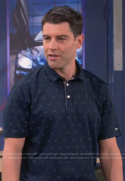 Dave's navy printed golf polo on The Neighborhood