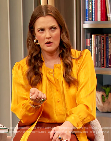 Drew's yellow jacquard tie neck blouse on The Drew Barrymore Show