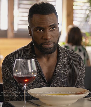 Eric's black printed shirt on Queens