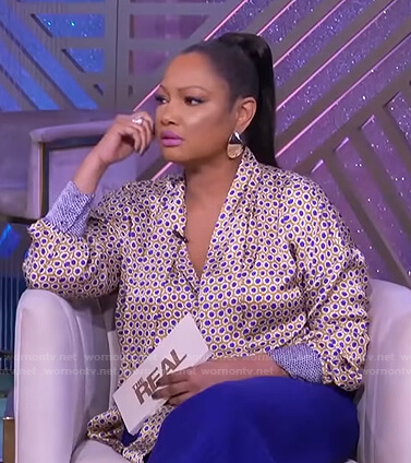Garcelle's yellow floral tie neck blouse on The Real