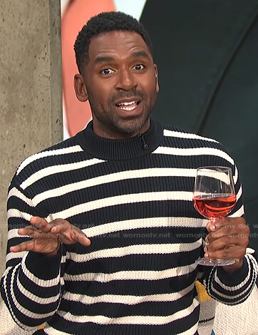 Justin's black striped sweater on E! News Daily Pop