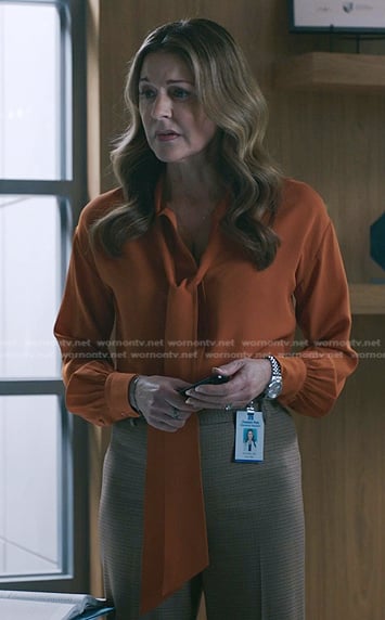 Kit's orange tie neck blouse on The Resident