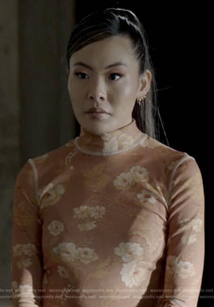 Mary's orange floral mock neck top on Batwoman