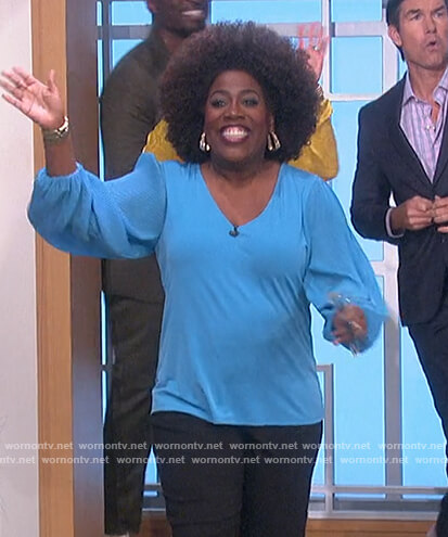 Sheryl's blue v-neck top on The Talk