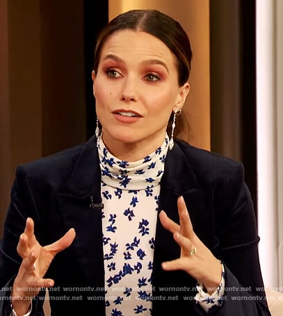 Sophia Bush's white floral print mock neck top on The Drew Barrymore Show