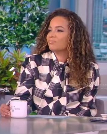 Sunny's print tie neck blouse and green pants on The View