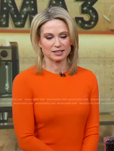 Amy's orange ribbed top and brown leather leggings on Good Morning America