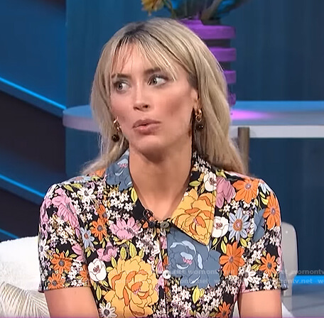 Arielle Vandenberg’s floral short sleeve shirt on E! News Nightly Pop