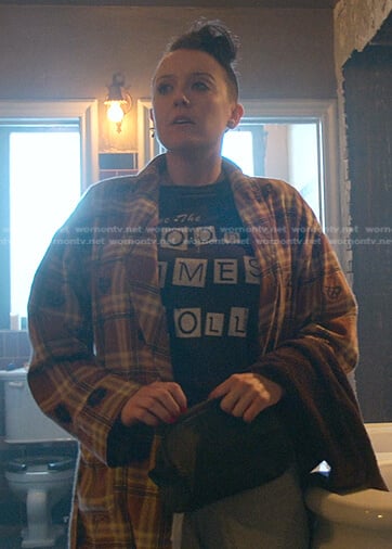 Kelly's black graphic tee and plaid mushroom robe on Good Trouble