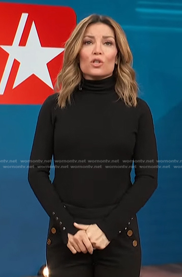 Kit's black button cuff turtleneck sweater on Access Hollywood