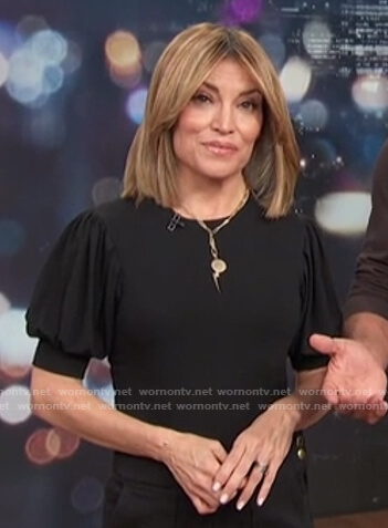 Kit's black puff short sleeve top on Access Hollywood
