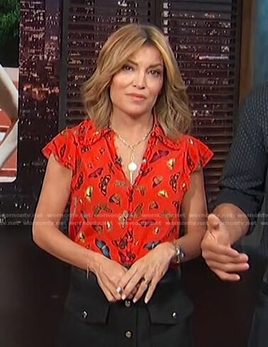 Kit's red butterfly print blouse on Access Hollywood