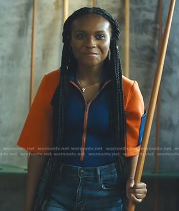 Naomi's orange and blue colorblock top on Naomi