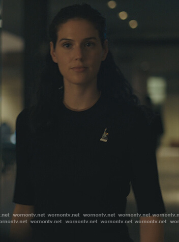 Rian's black ribbed short sleeve sweater on Billions