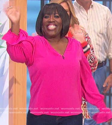 Sheryl's pink bell cuff top on The Talk