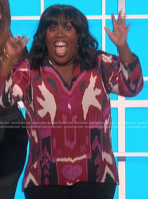 Sheryl's pink printed sweater on The Talk