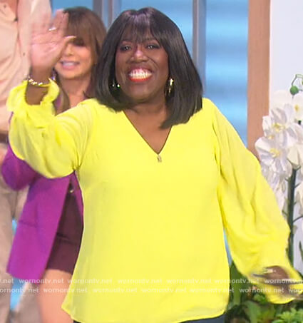 Sheryl's yellow smocked v-neck top on The Talk
