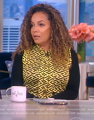 Sunny's yellow monogram print tie neck blouse on The View