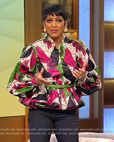 Tamron's multi colored peplum top on Tamron Hall Show