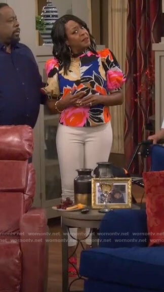 Tina's floral puff sleeve top on The Neighborhood