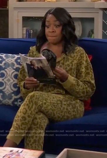 Tina's green leopard print hoodie and sweatpants on The Neighborhood