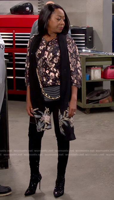 Tina's metallic patterned blouse on The Neighborhood