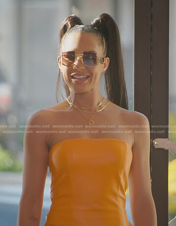 Amanza's orange strapless leather dress on Selling Sunset