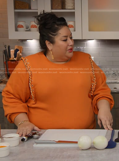 Ayesha Nurdjaja's orange chain-trim sweatshirt on Today